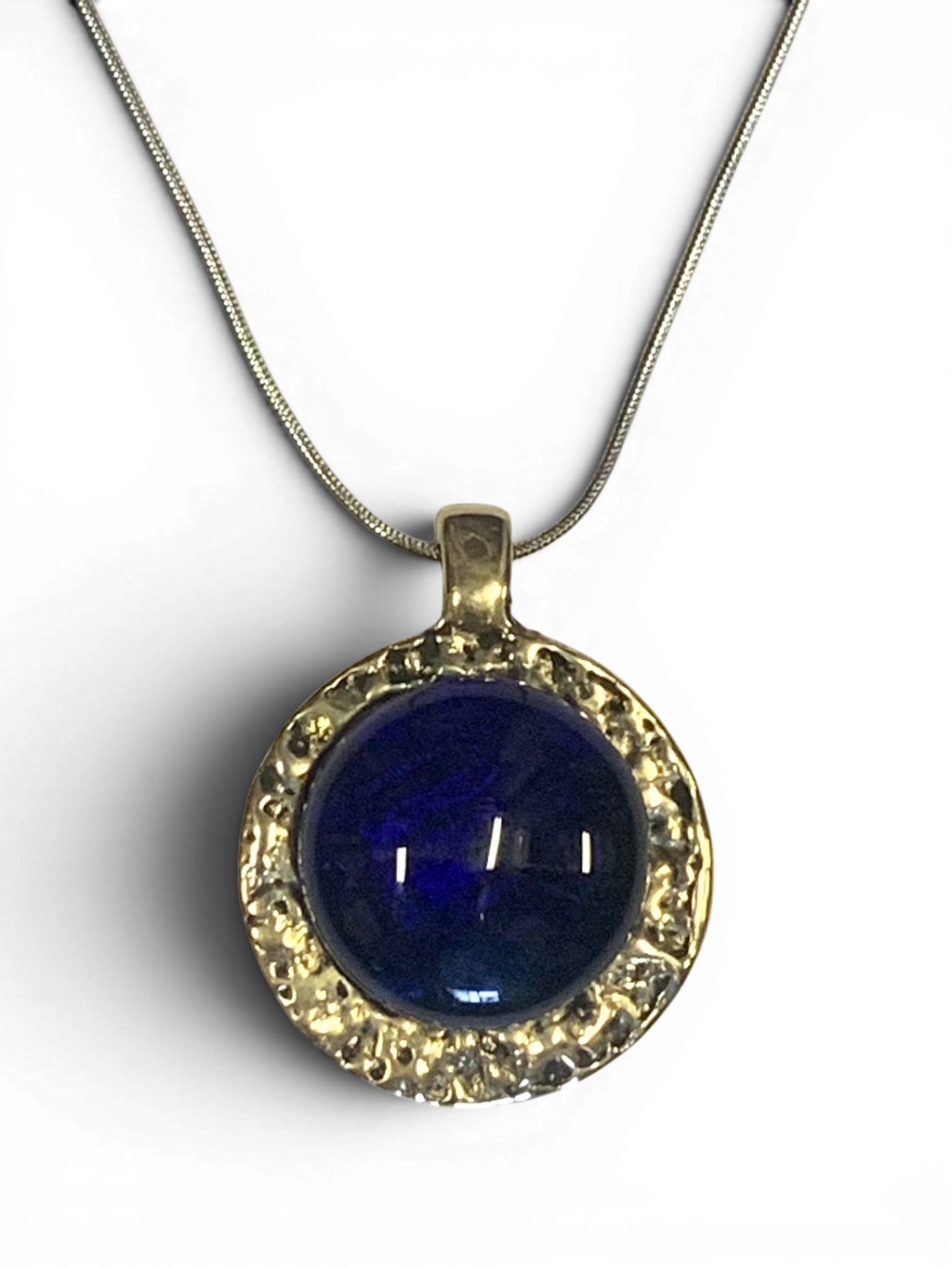 Bronze pendant with deep blue custom-made glass insert