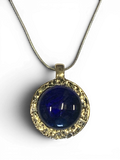 Bronze pendant with deep blue custom-made glass insert
