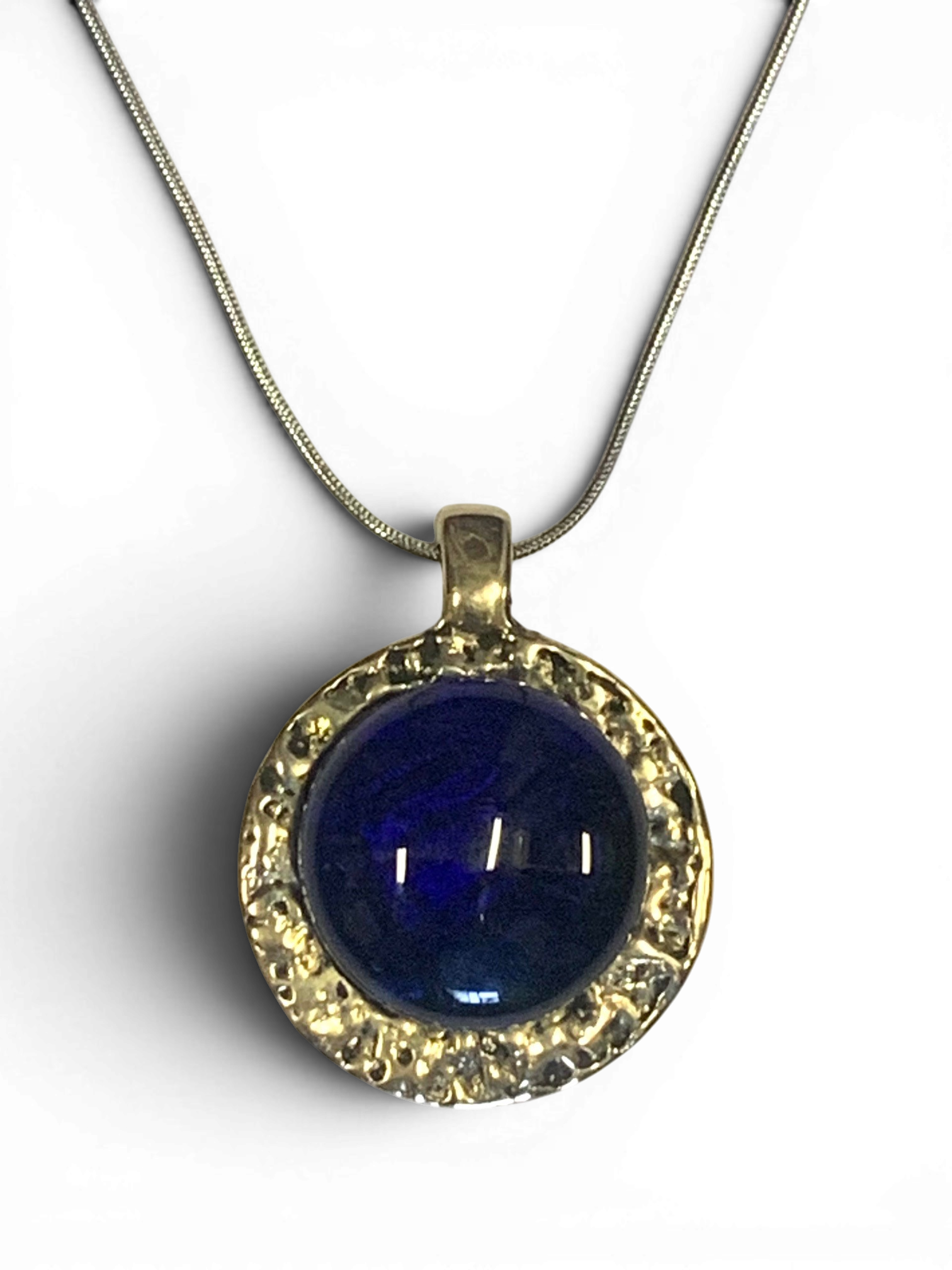Bronze pendant with deep blue custom-made glass insert