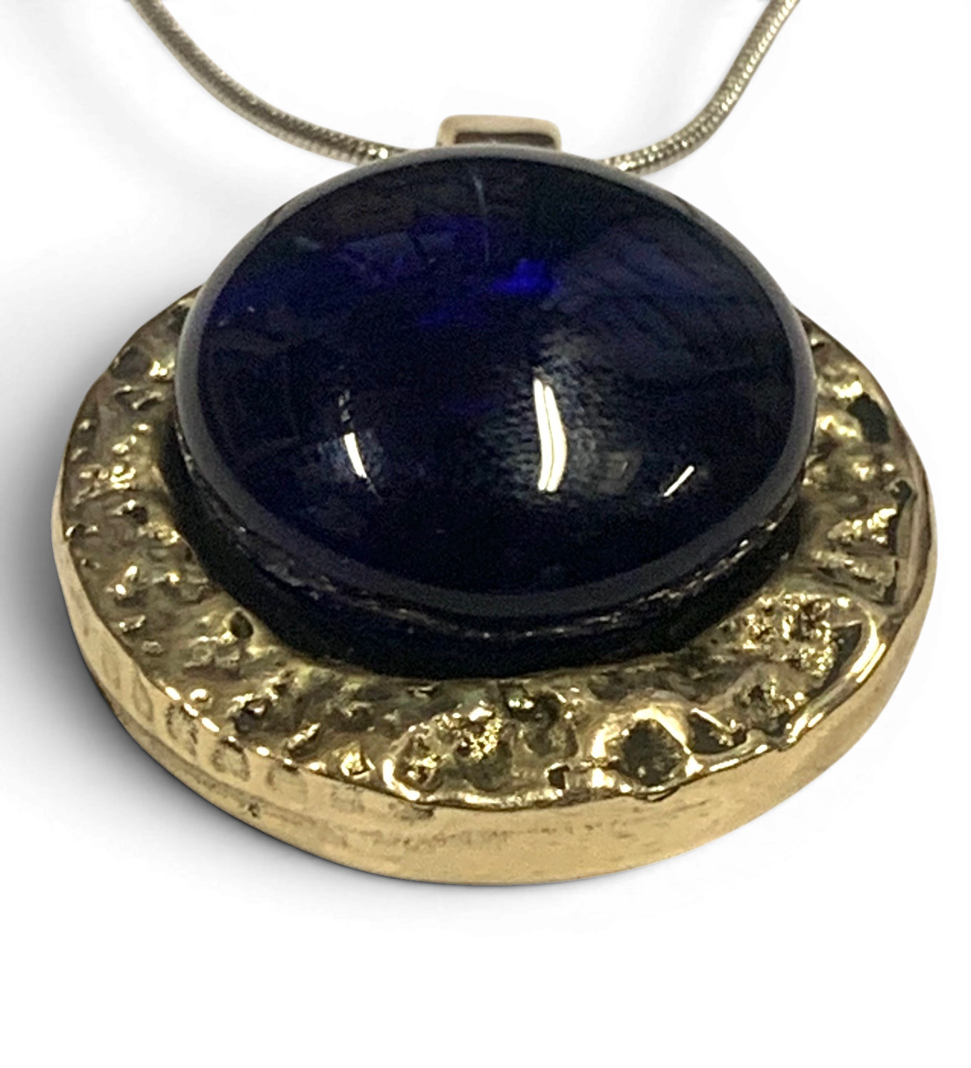 Bronze pendant with deep blue custom-made glass insert