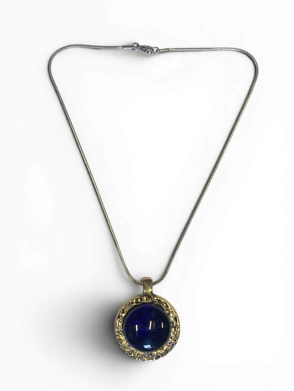 Bronze pendant with deep blue custom-made glass insert