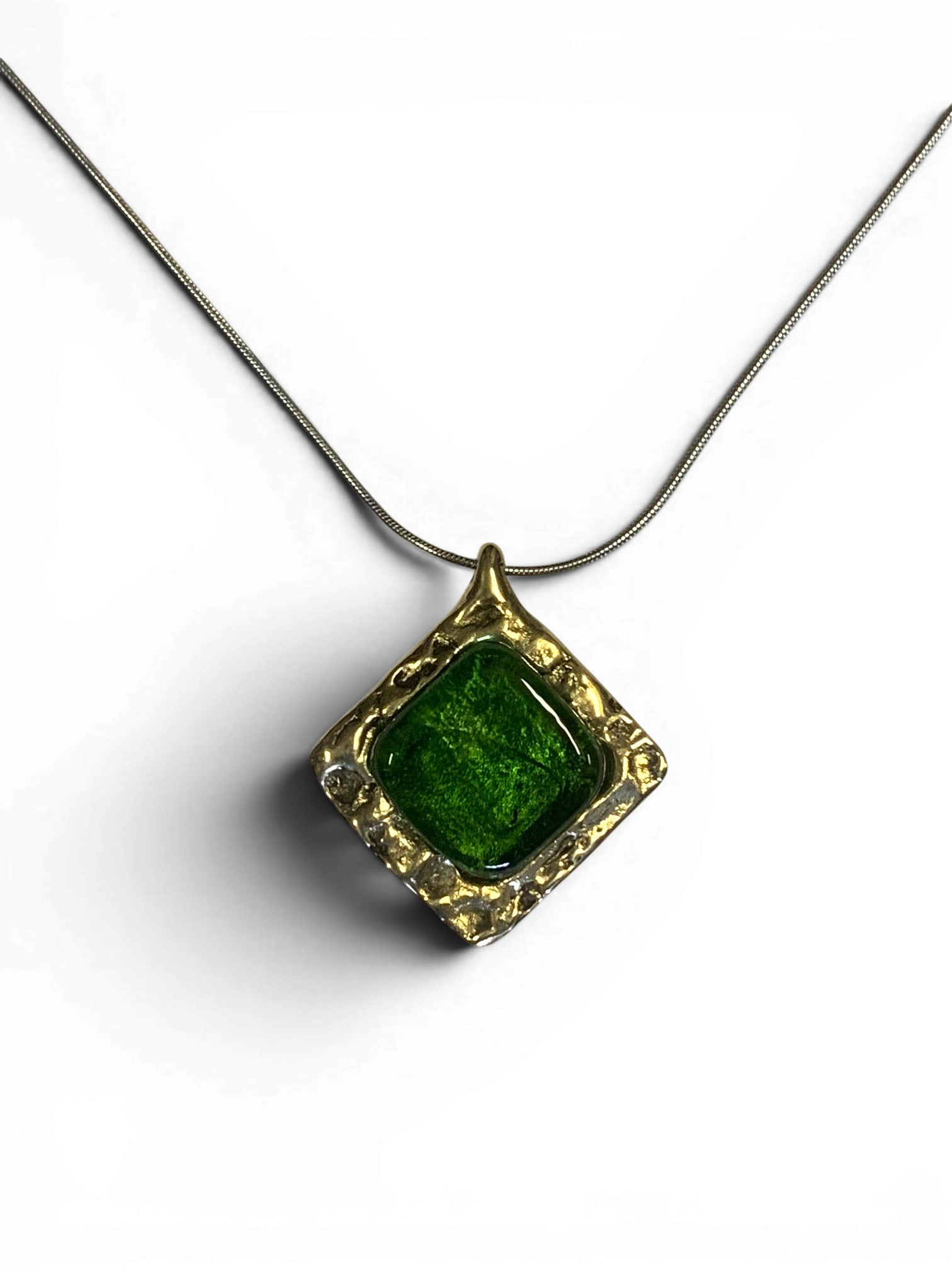 Bronze pendant with green custom-made glass insert