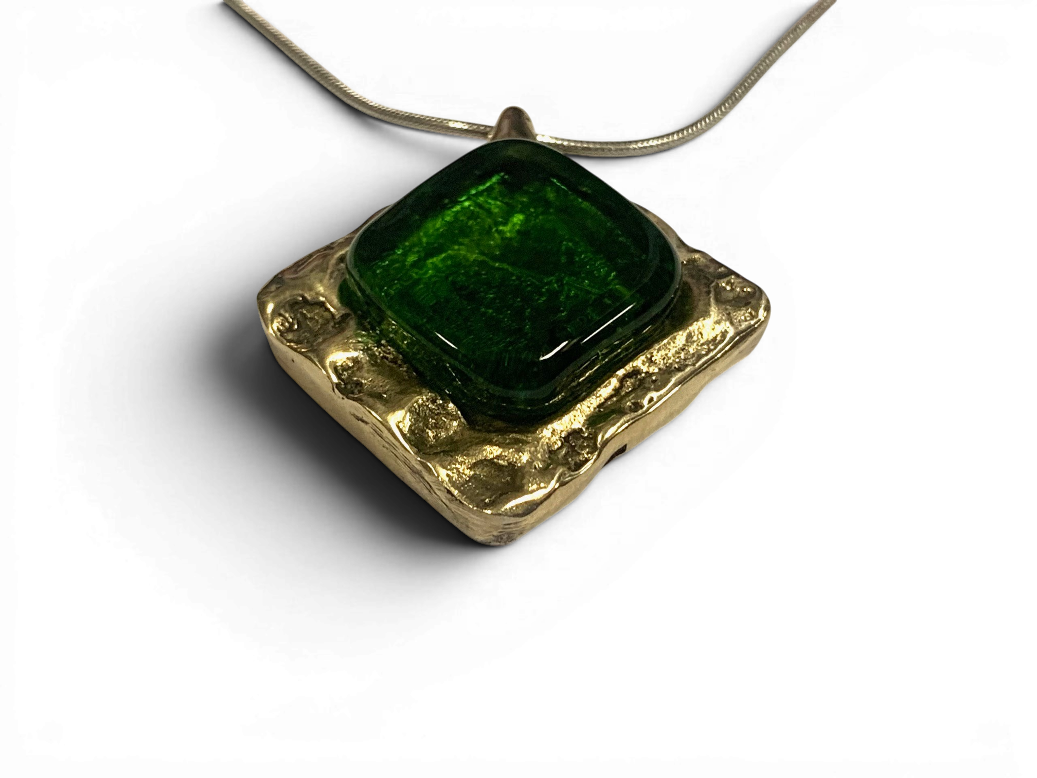 Bronze pendant with green custom-made glass insert