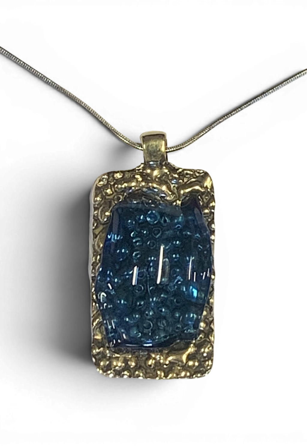 Bronze pendant with transperent blue custom-made glass insert