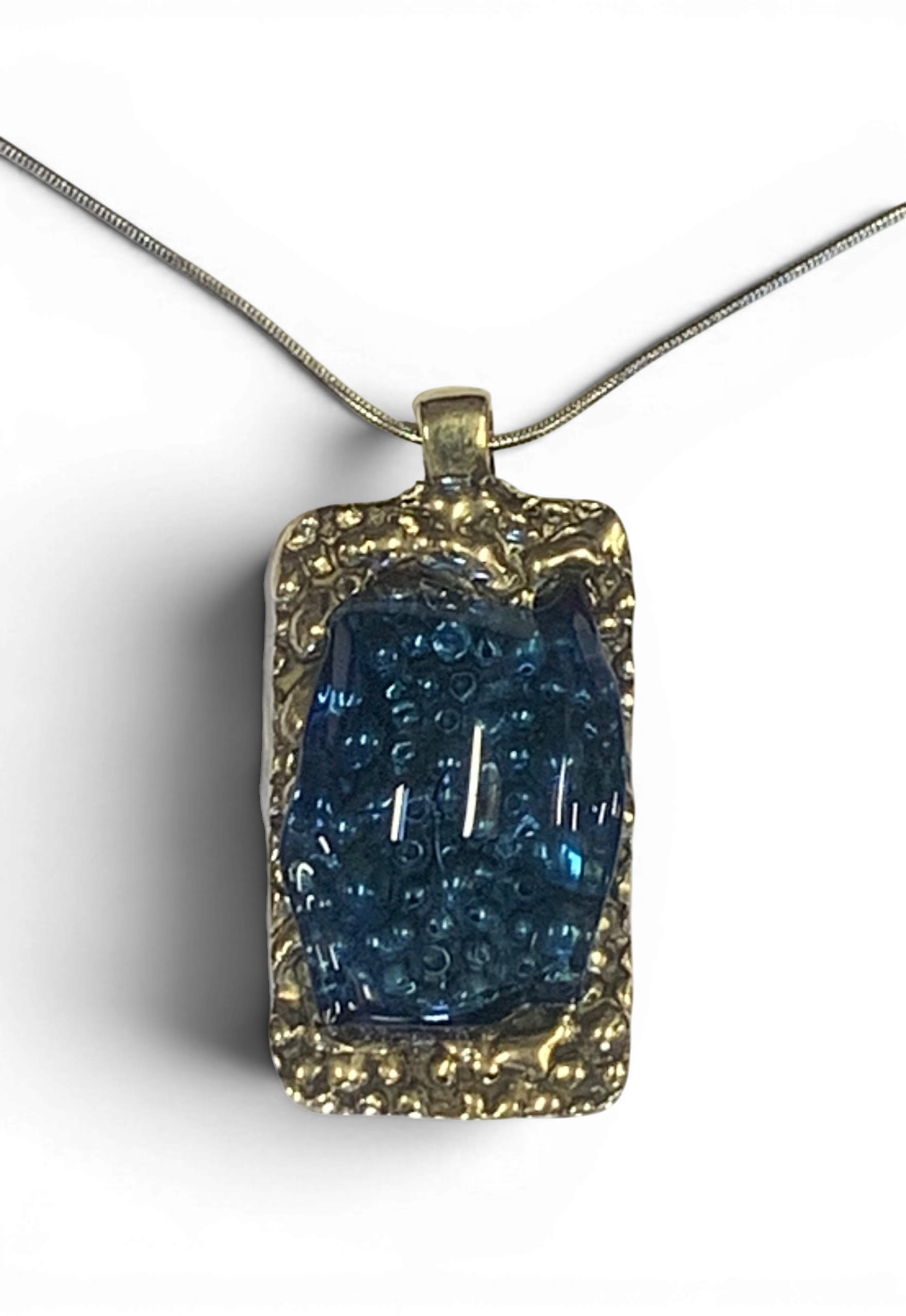 Bronze pendant with transperent blue custom-made glass insert