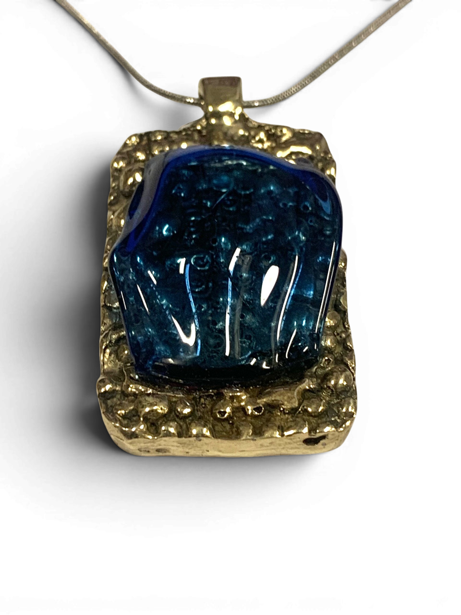 Bronze pendant with transperent blue custom-made glass insert
