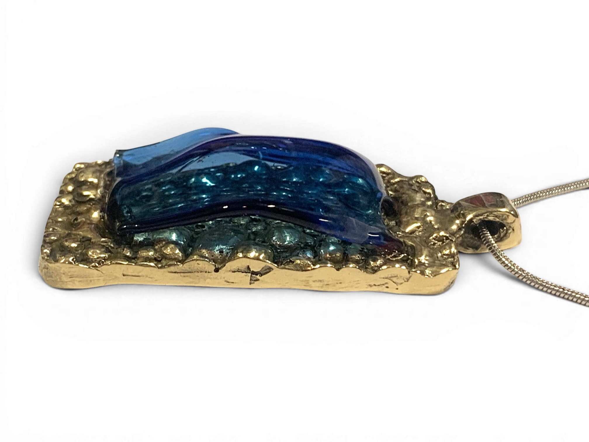 Bronze pendant with transperent blue custom-made glass insert