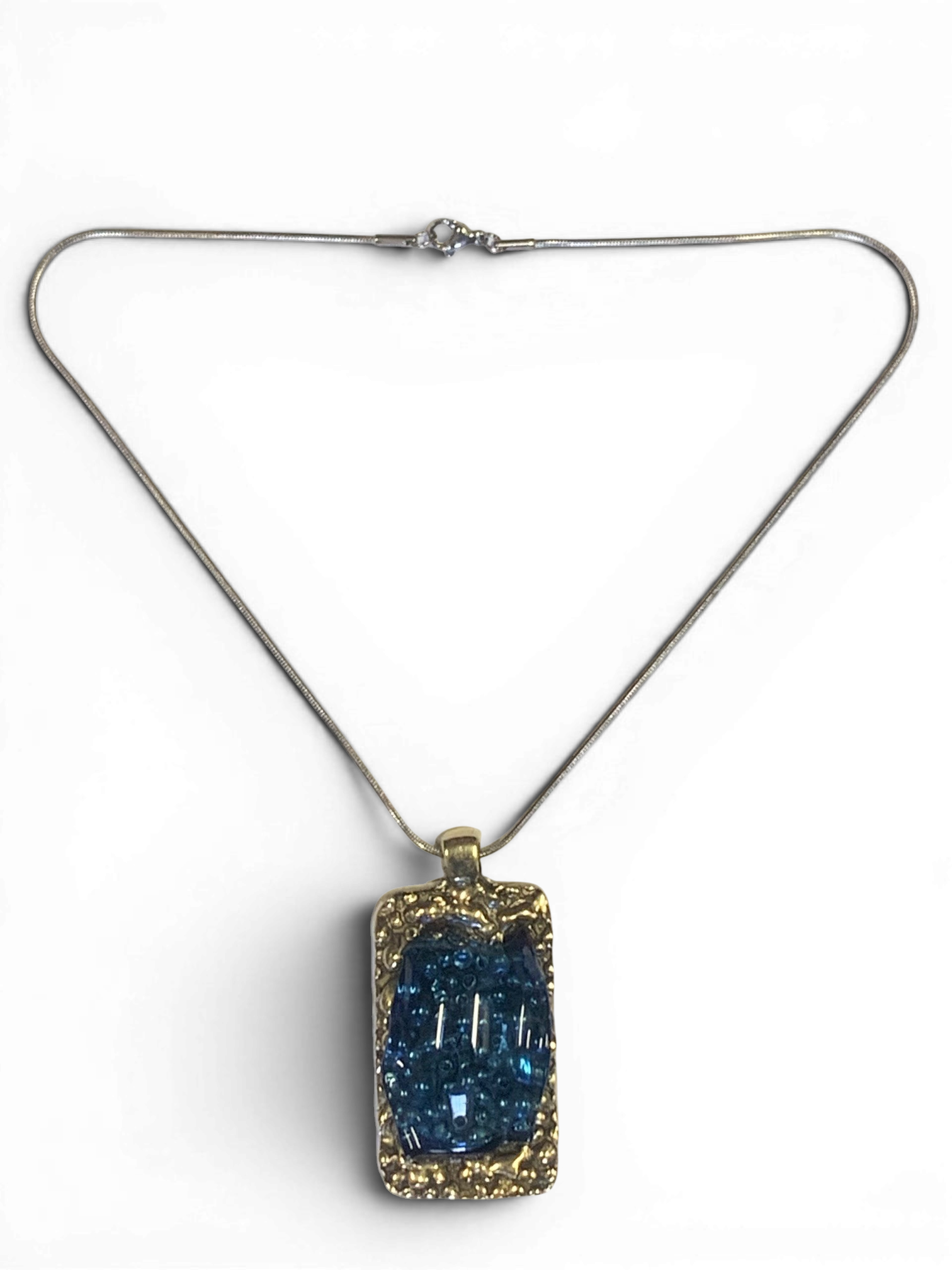 Bronze pendant with transperent blue custom-made glass insert