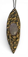 White bronze oval pendant with crystal rock insert and polish finishing.