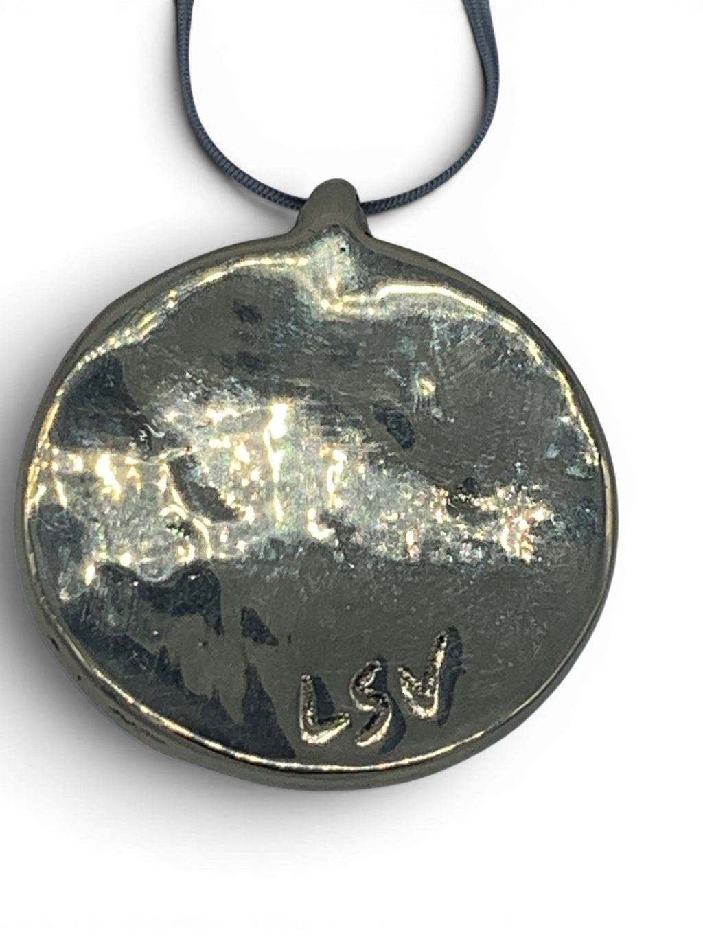 Bronze pendant with green quartz insert