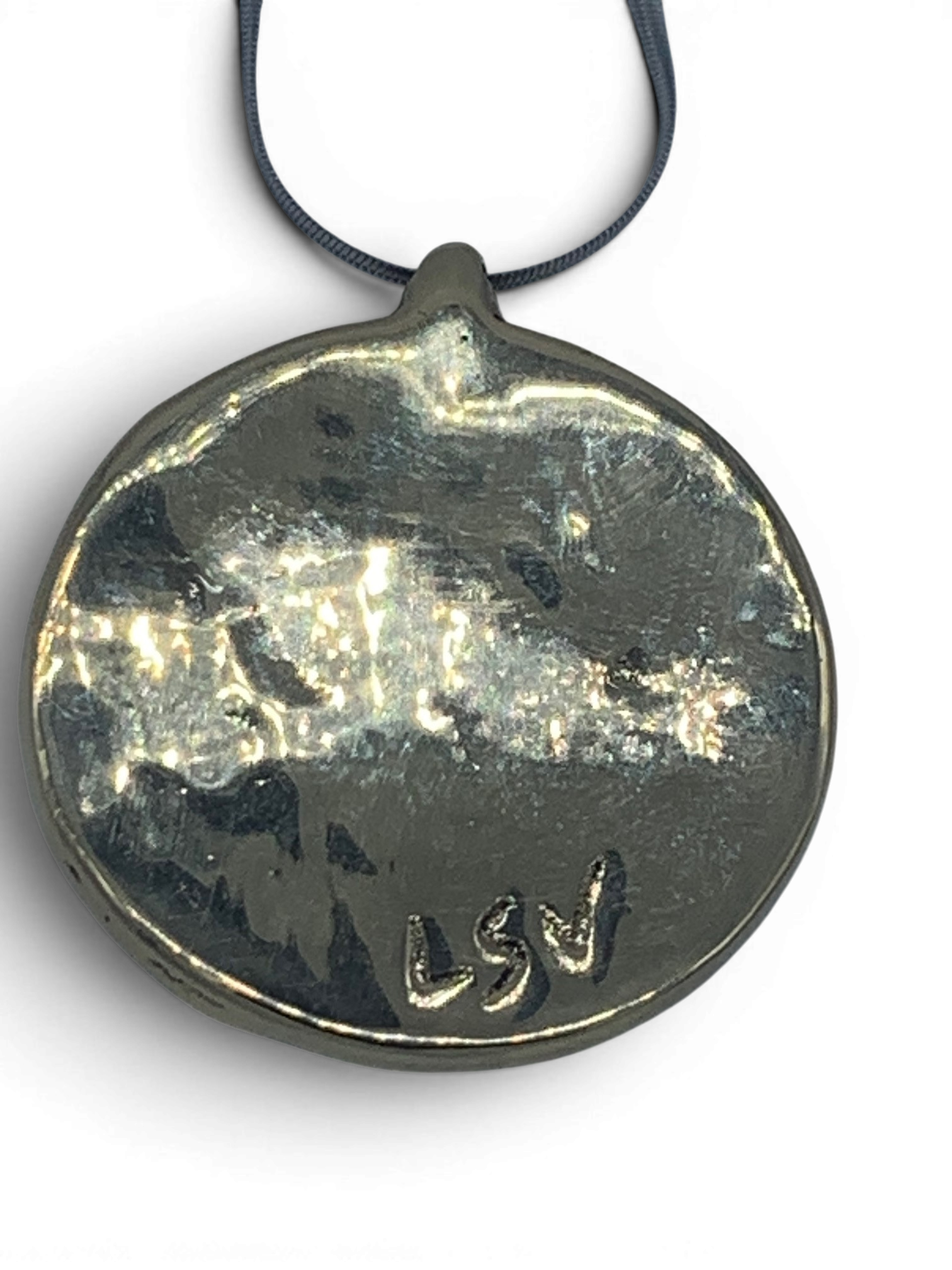 Bronze pendant with green quartz insert