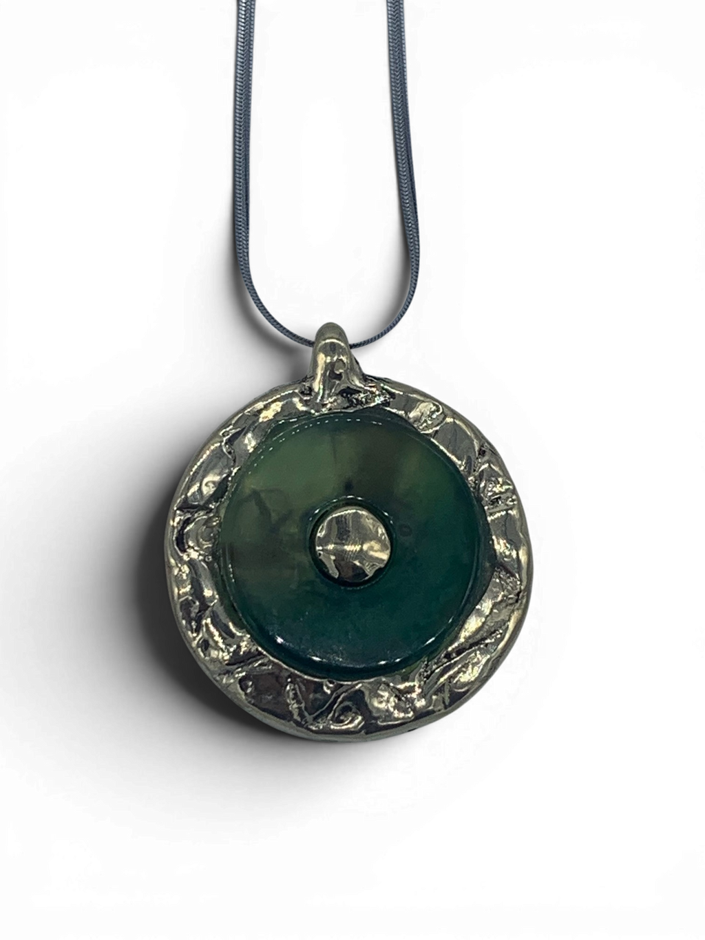 Bronze pendant with green quartz insert