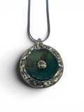 Bronze pendant with green quartz insert