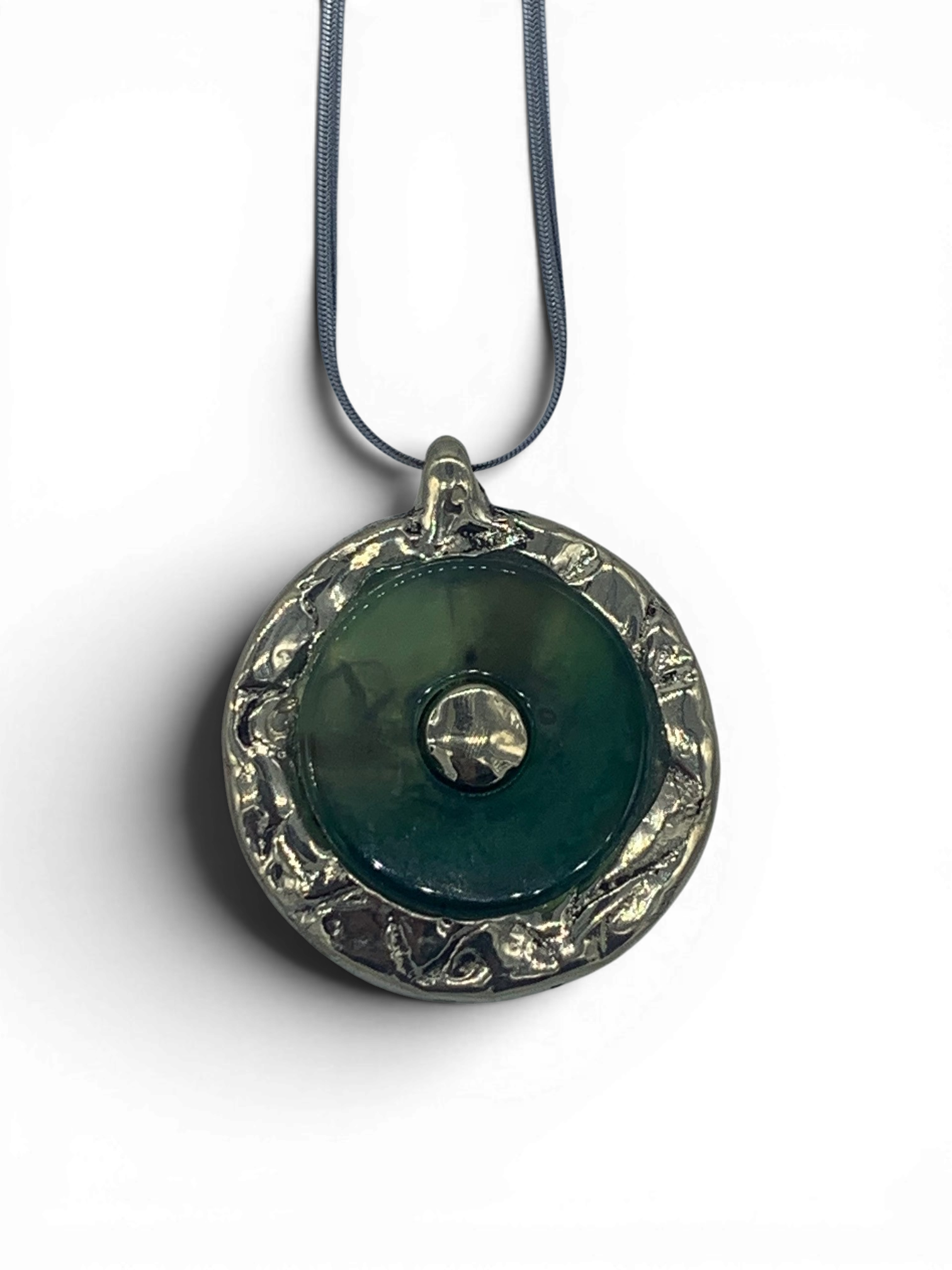 Bronze pendant with green quartz insert