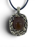 Bronze pendant with carnelian stone insert