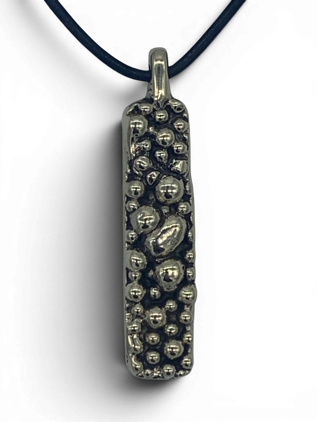 Bronze pendant with round texturized surface