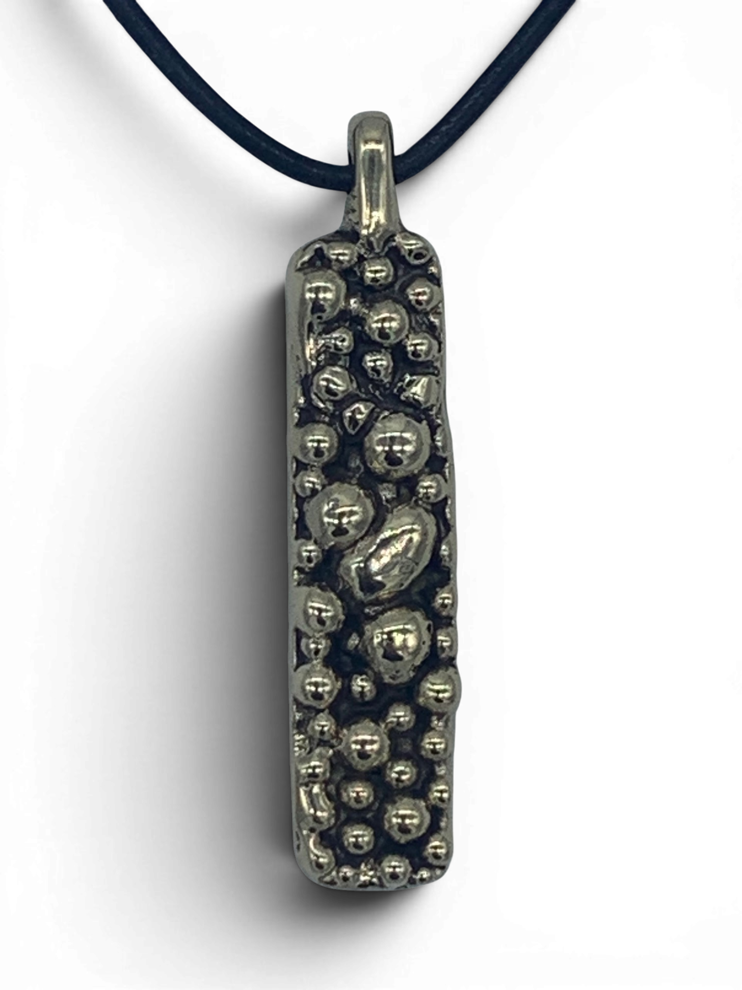 Bronze pendant with round texturized surface