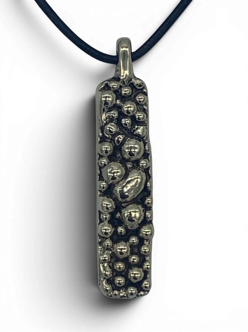Bronze pendant with round texturized surface