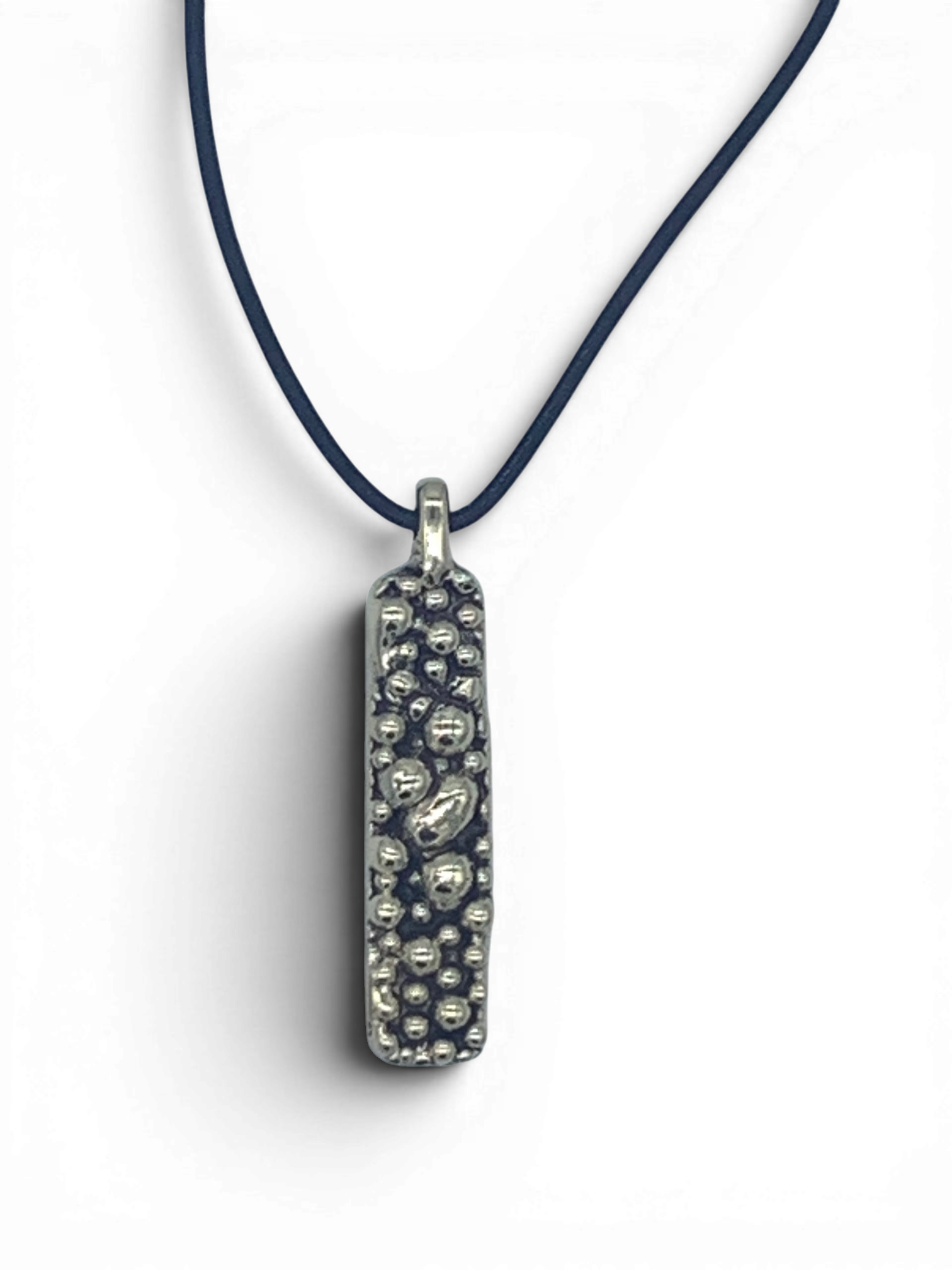 Bronze pendant with round texturized surface