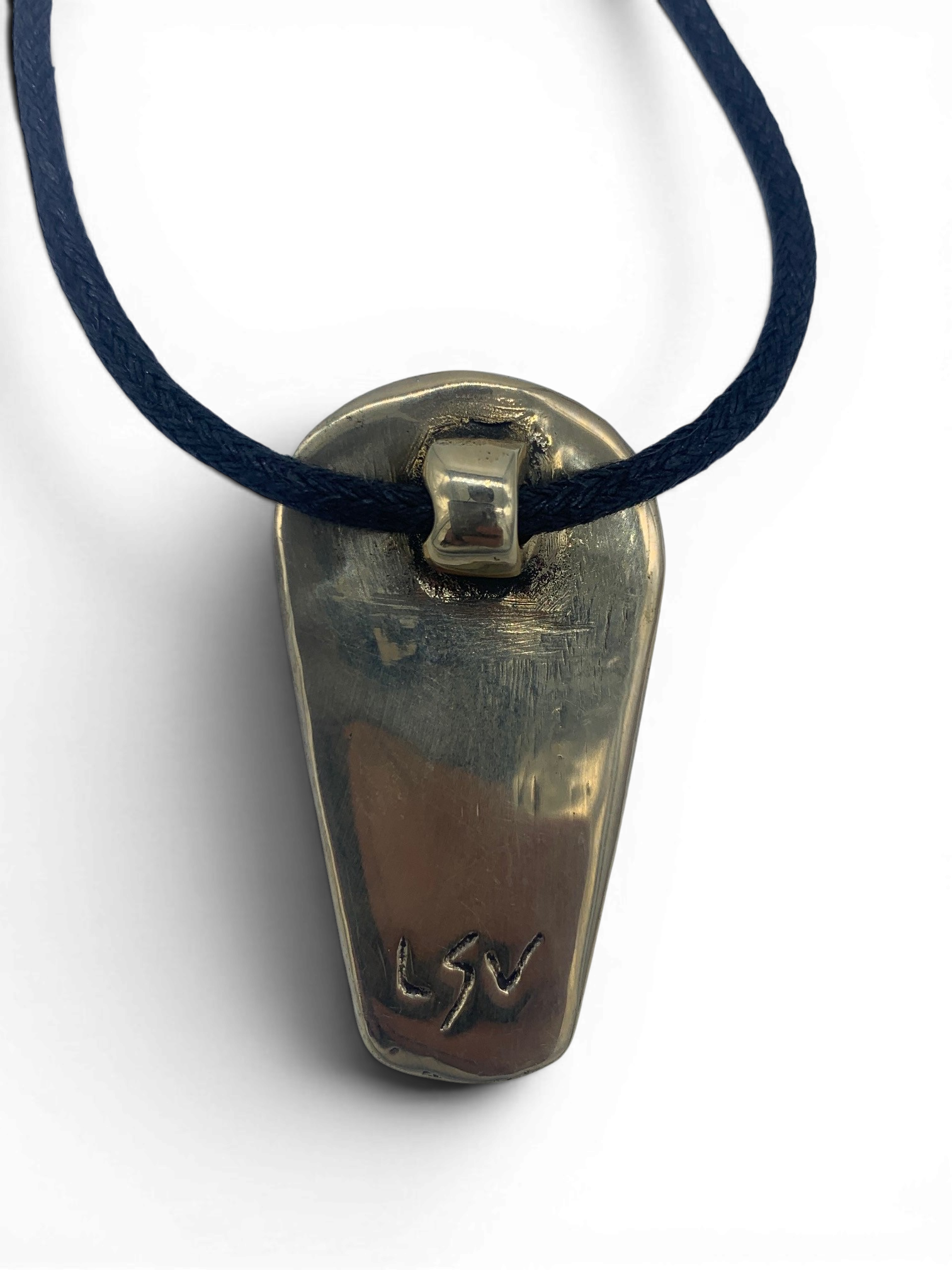 Bronze pendant with obsidian stone insert