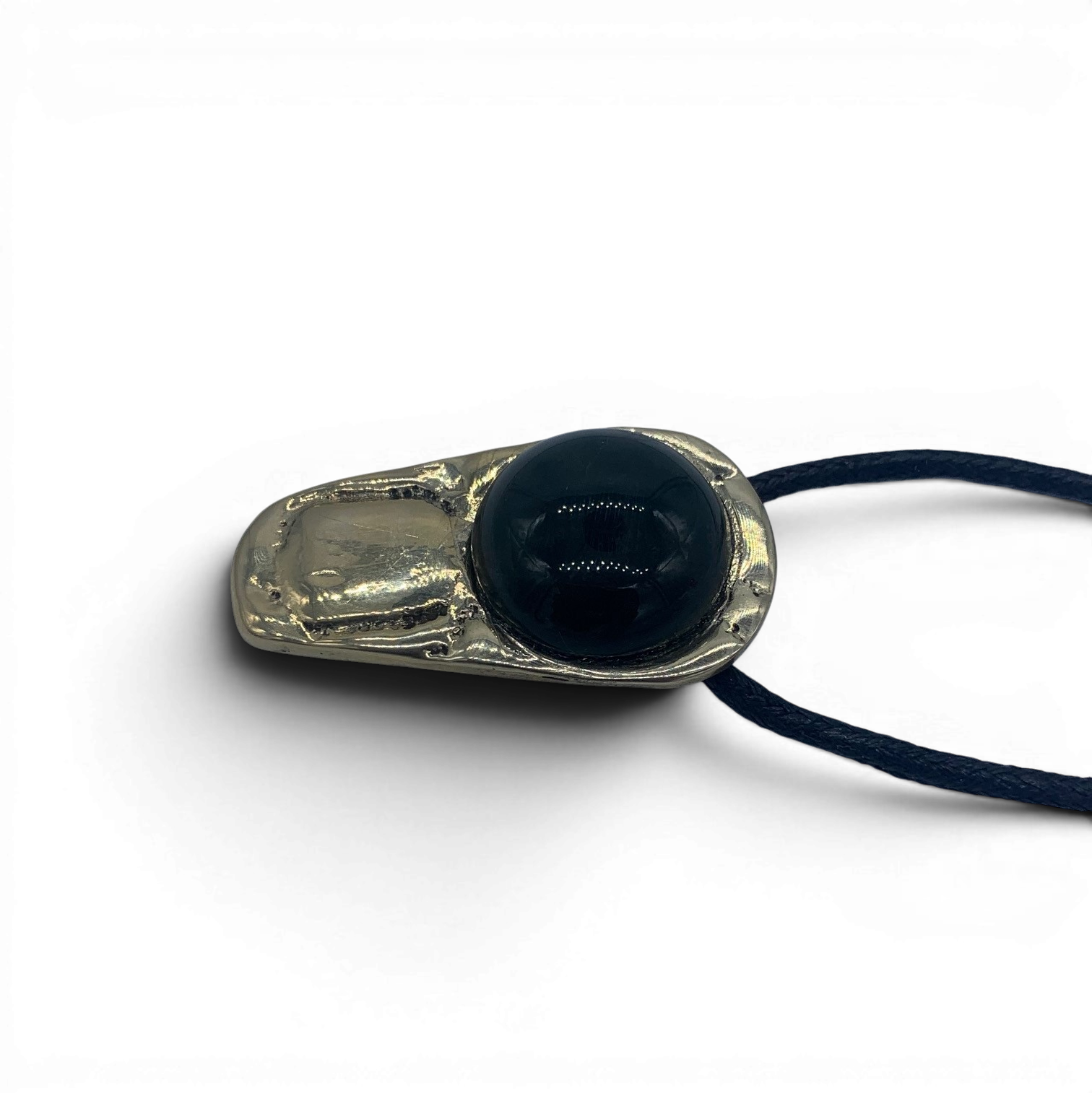 Bronze pendant with obsidian stone insert