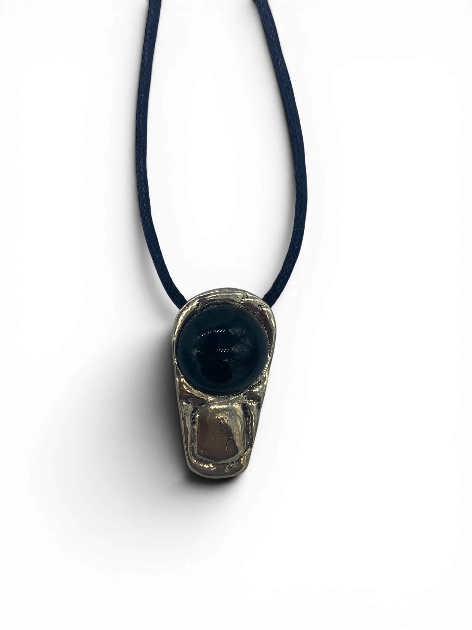 Bronze pendant with obsidian stone insert