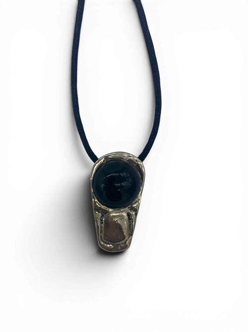 Bronze pendant with obsidian stone insert