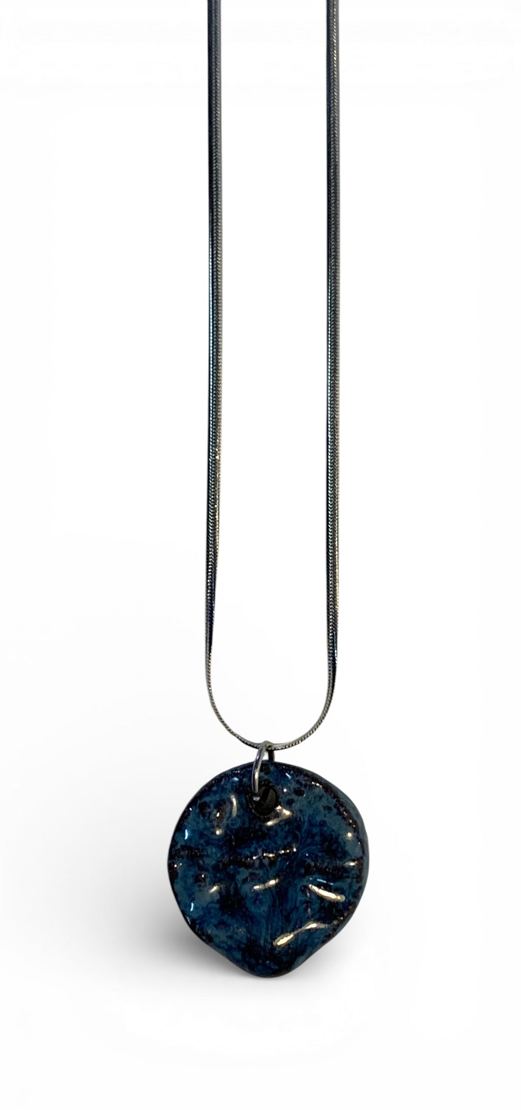 Ceramic pendant with stainless steel chain.