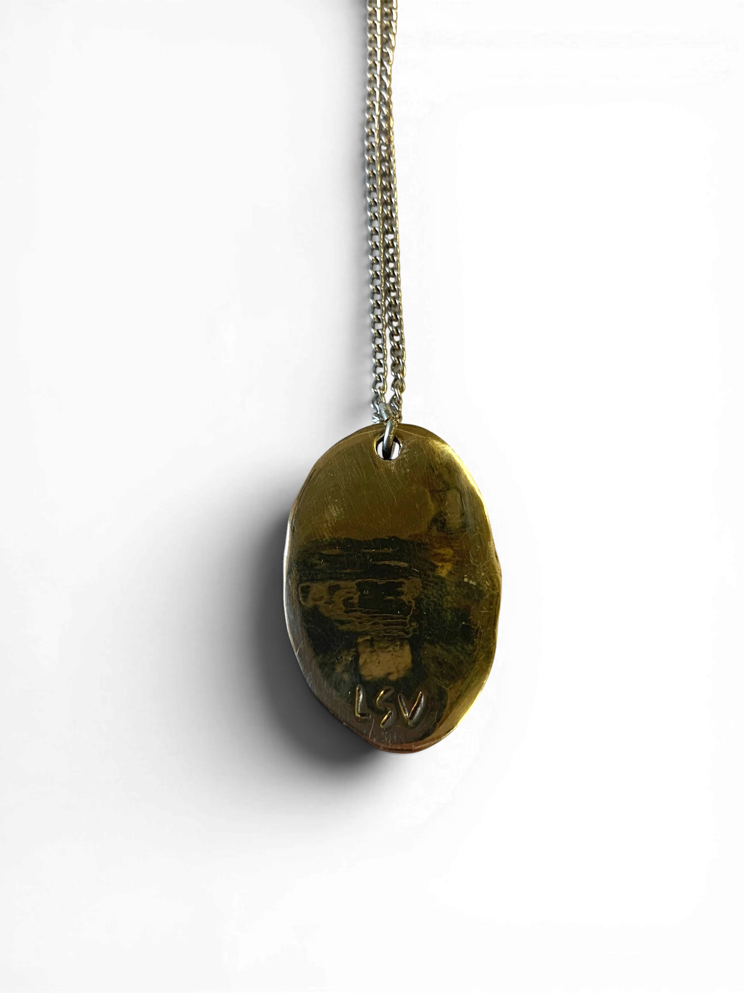 Oval bronze pendant with rock crystal insert