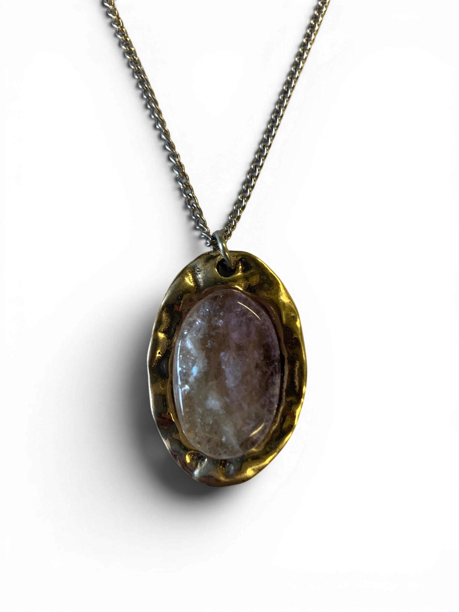 Oval bronze pendant with rock crystal insert