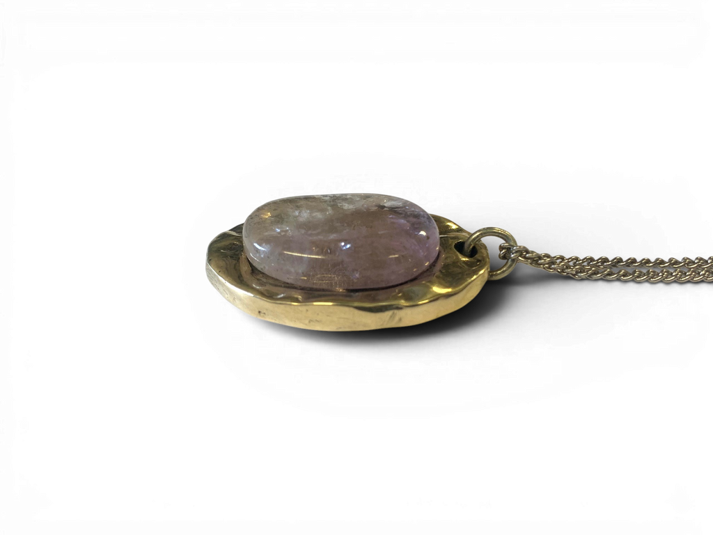 Oval bronze pendant with rock crystal insert