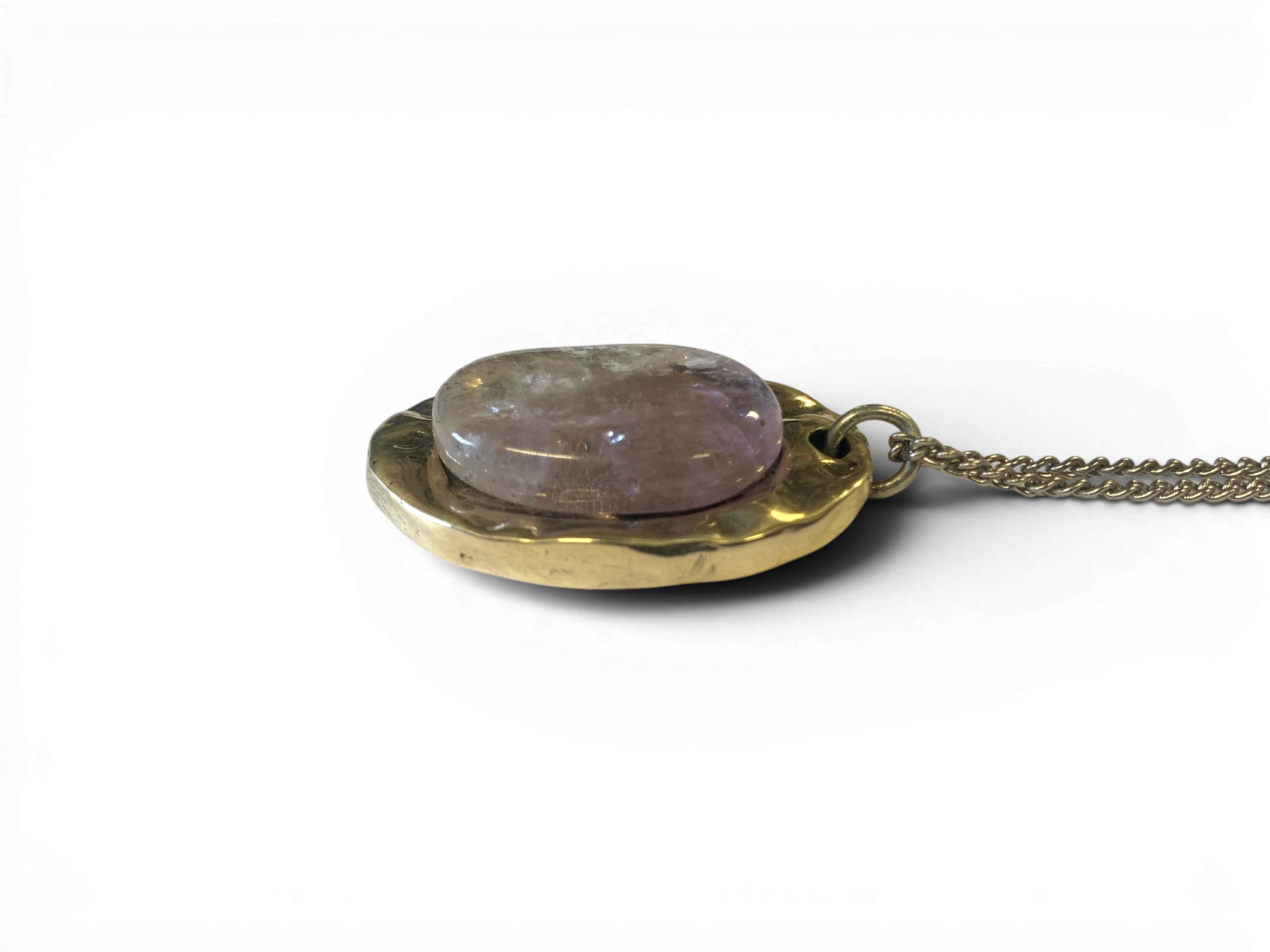 Oval bronze pendant with rock crystal insert