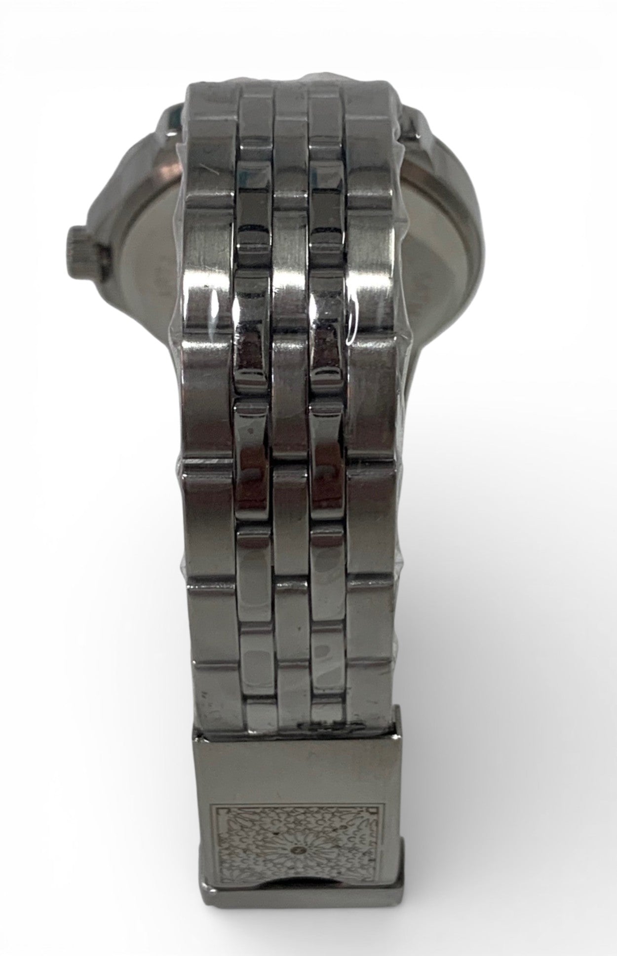 Stainless steel watch and bracelet with arabic motif background.