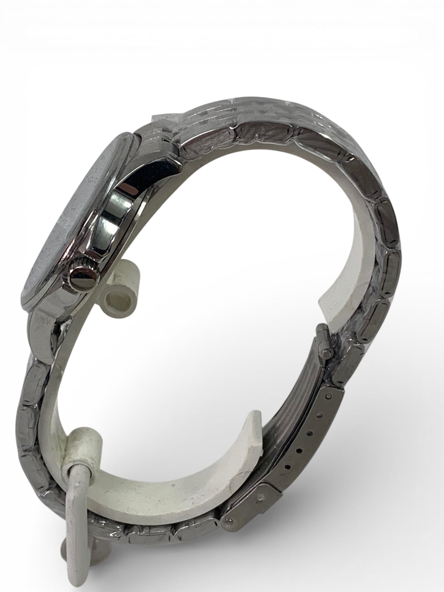 Stainless steel watch and bracelet with arabic motif background.