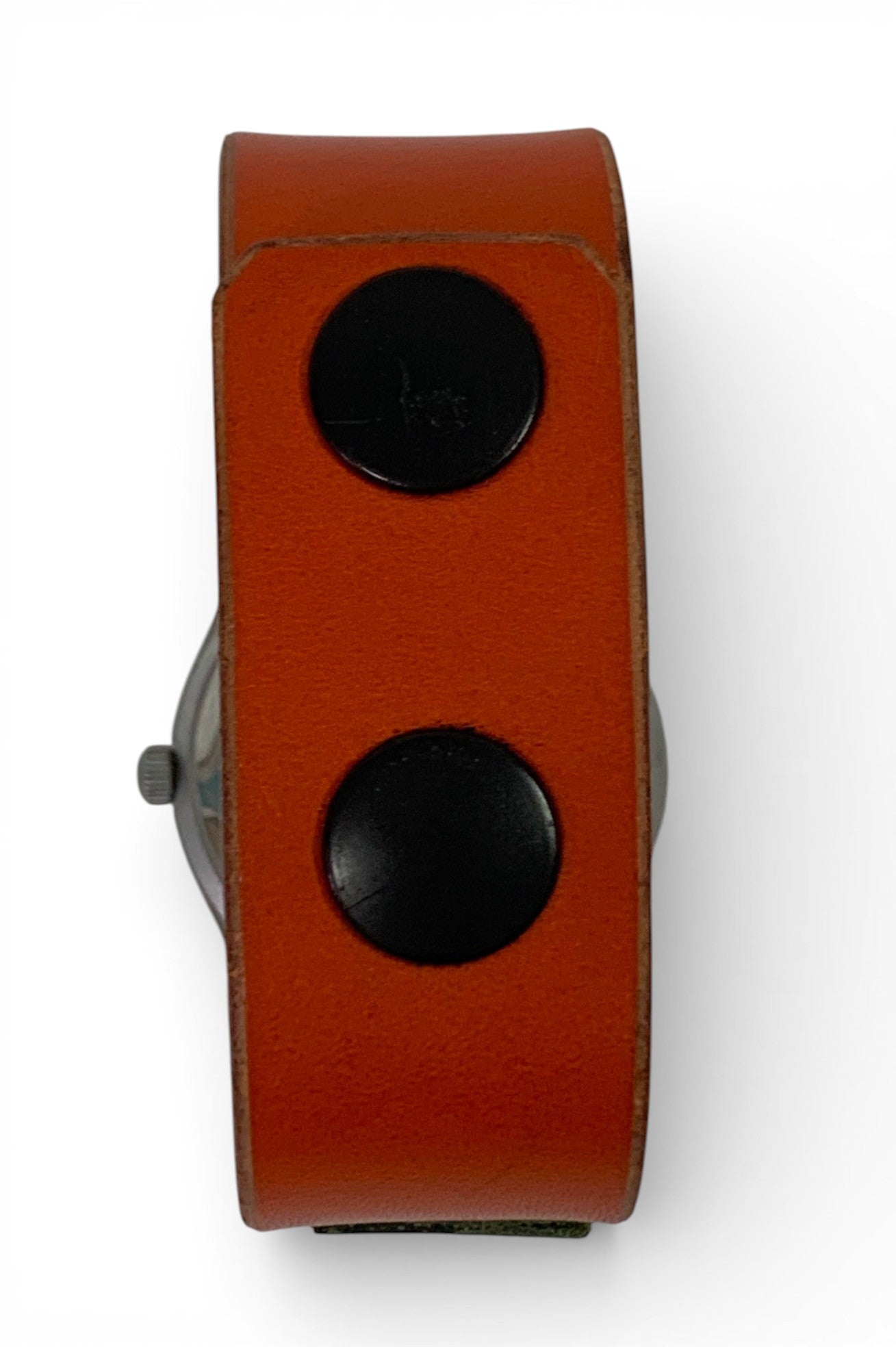 Man watch with hand-made leather bracelet with push bottoms closing.