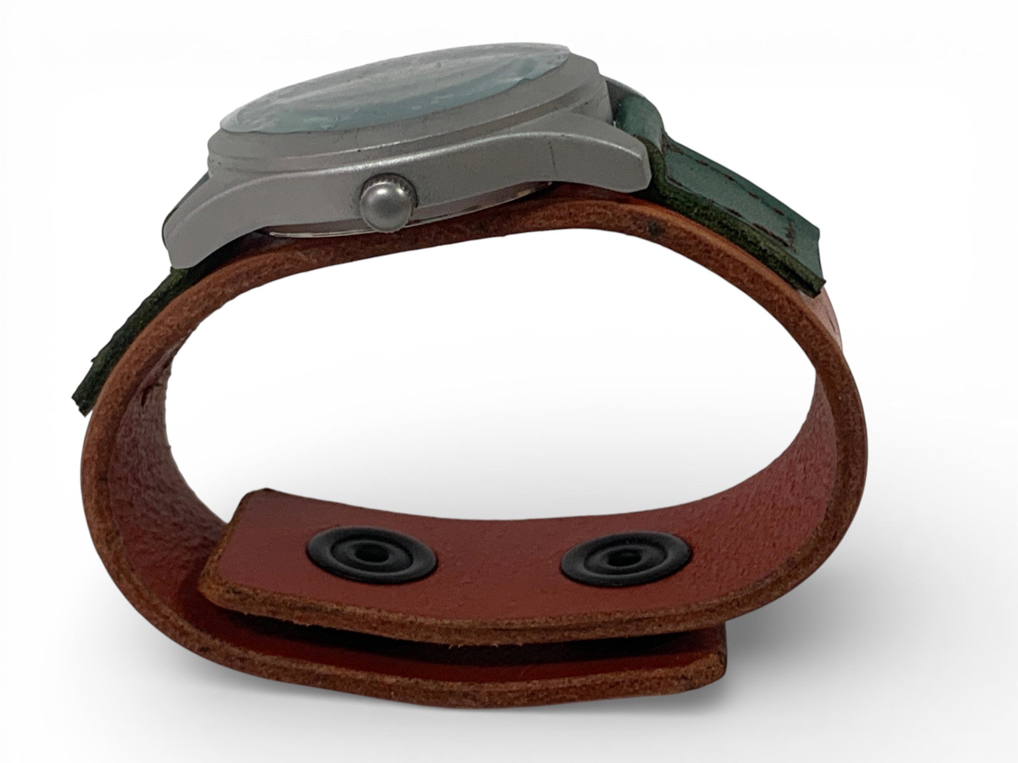 Man watch with hand-made leather bracelet with push bottoms closing.