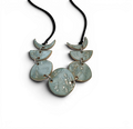 Hand-made ceramic necklace with sky cyan enamel