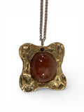 Bronze pendant with oval agate stone insert