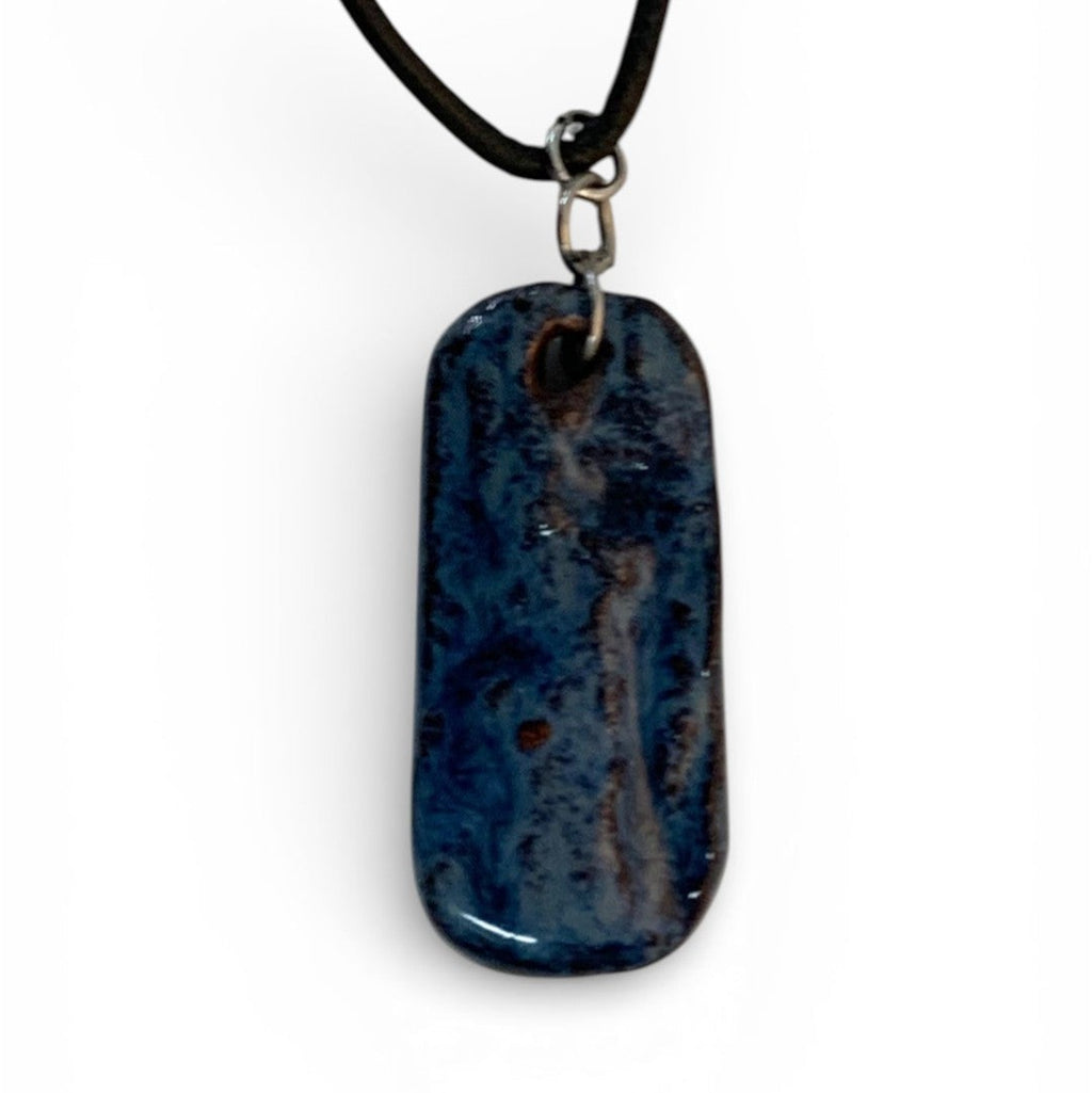 Ceramic hand-made pendant with ocean deep blue enamel.