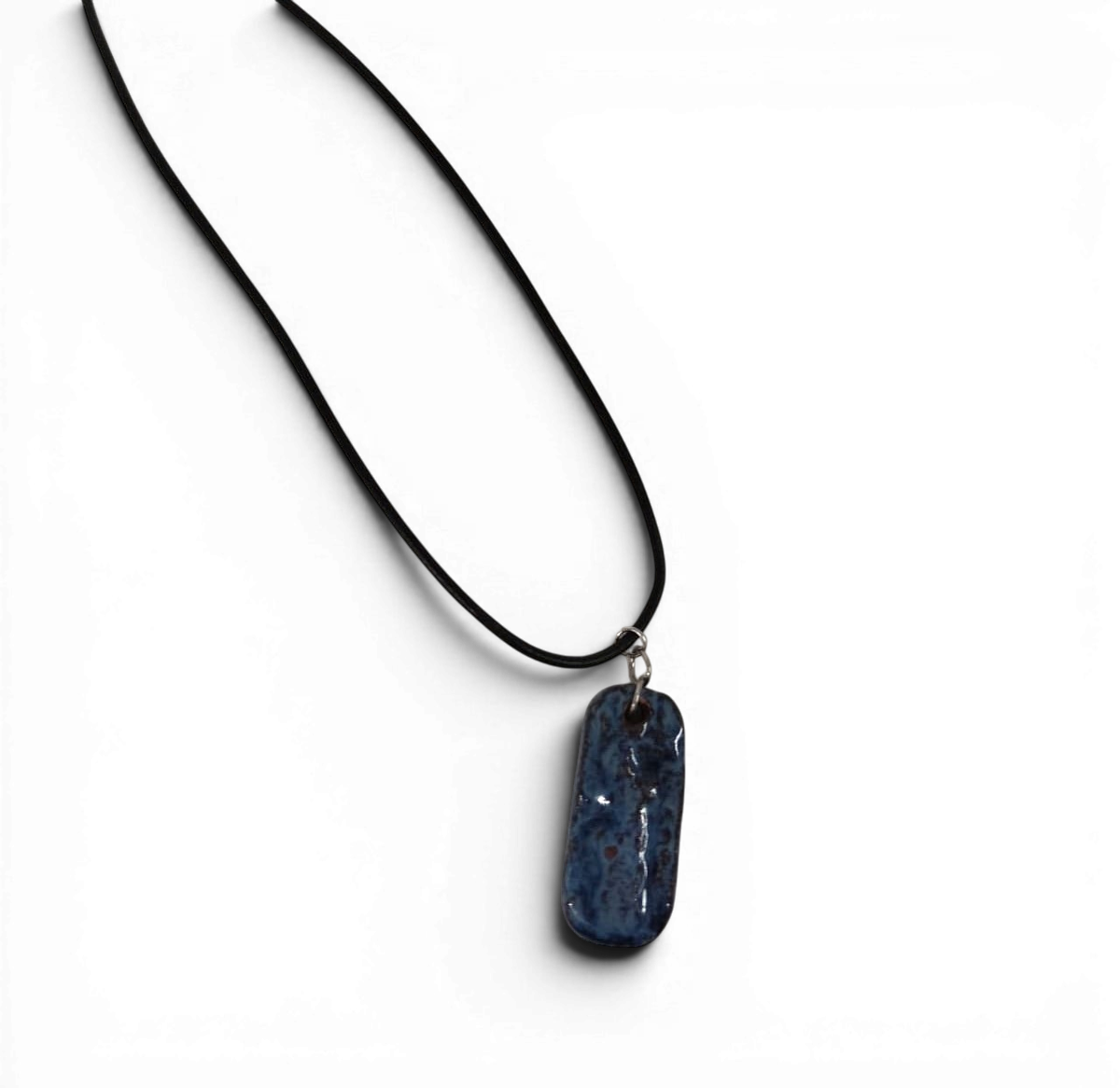 Ceramic hand-made pendant with ocean deep blue enamel.