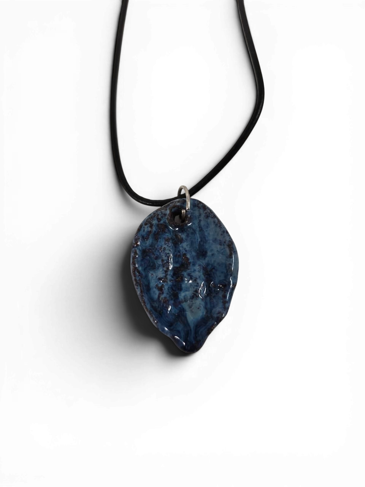 Ceramic hand-made pendant with ocean deep blue enamel.