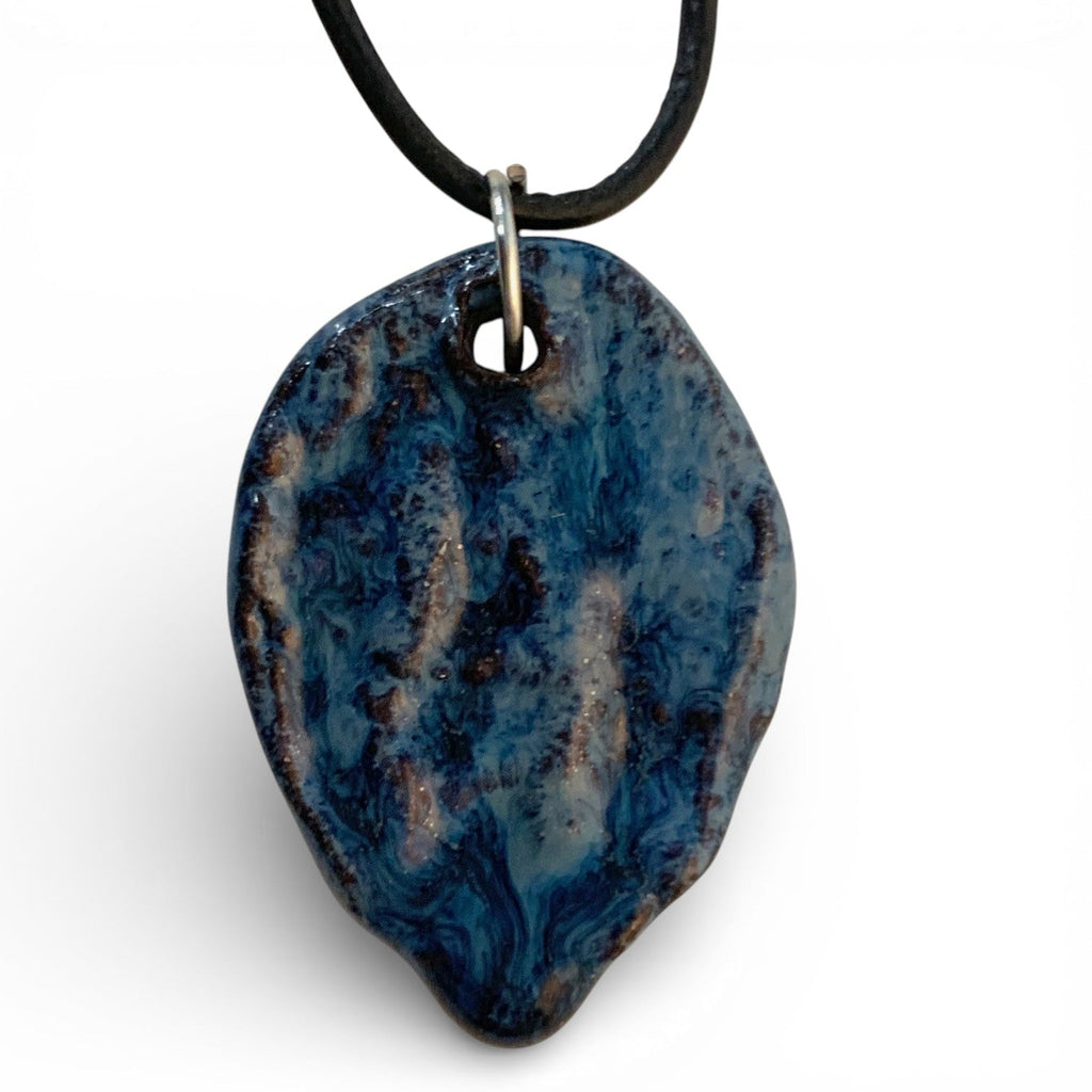 Ceramic hand-made pendant with ocean deep blue enamel.