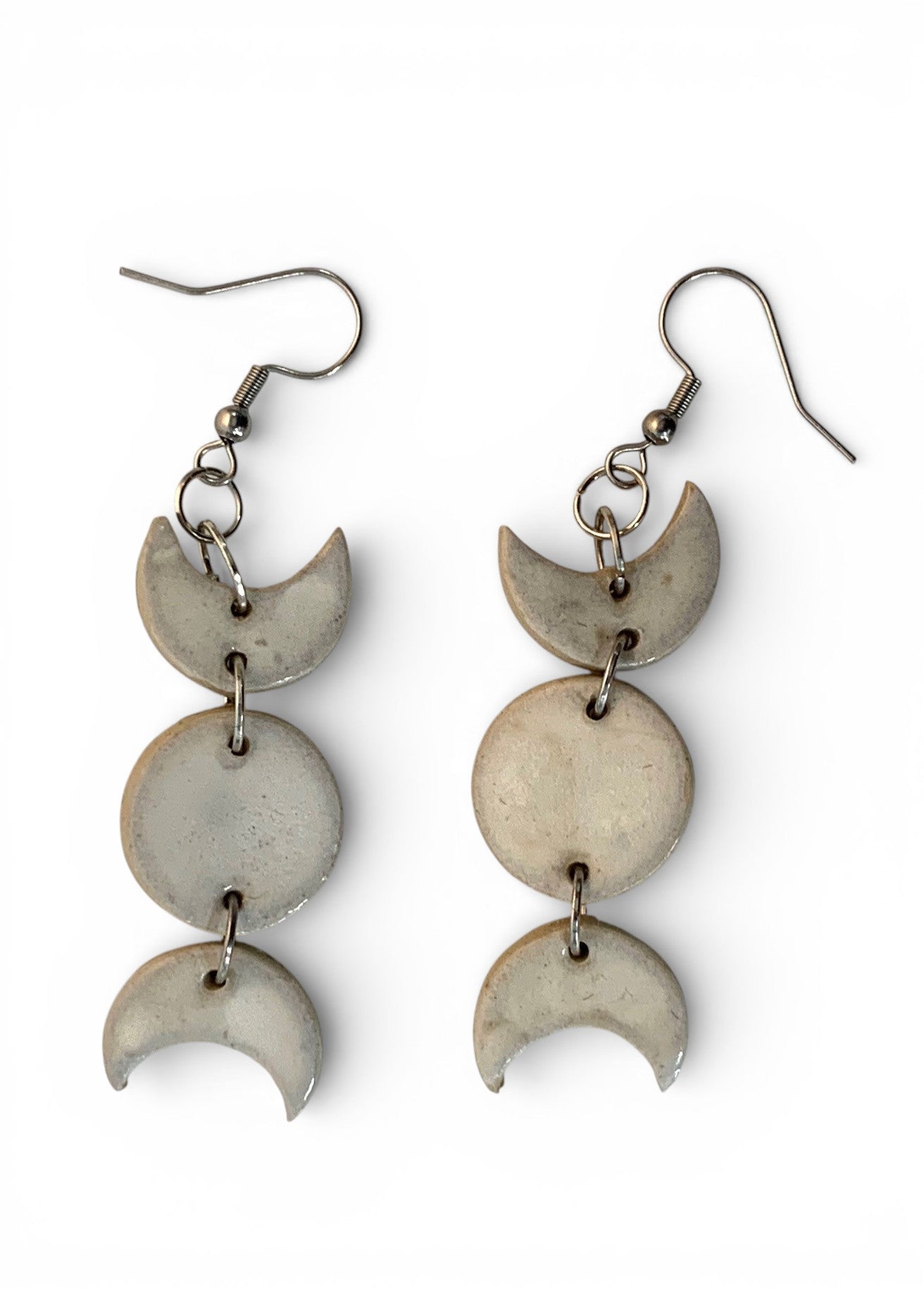 Ceramic hand-made earring with sky-white cyan enamel.