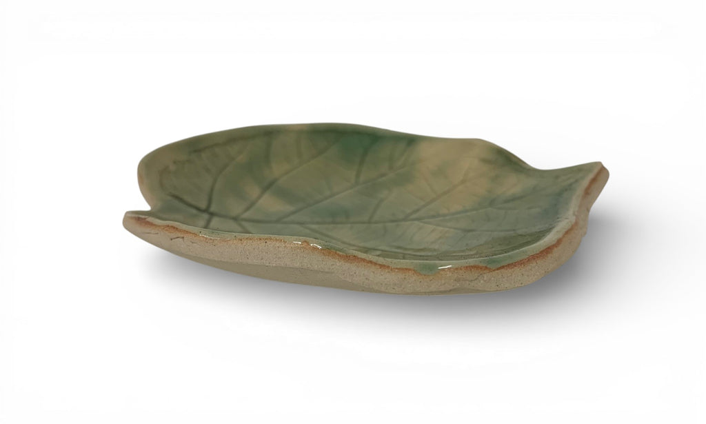 Hand-made ceramic plate with green enamel