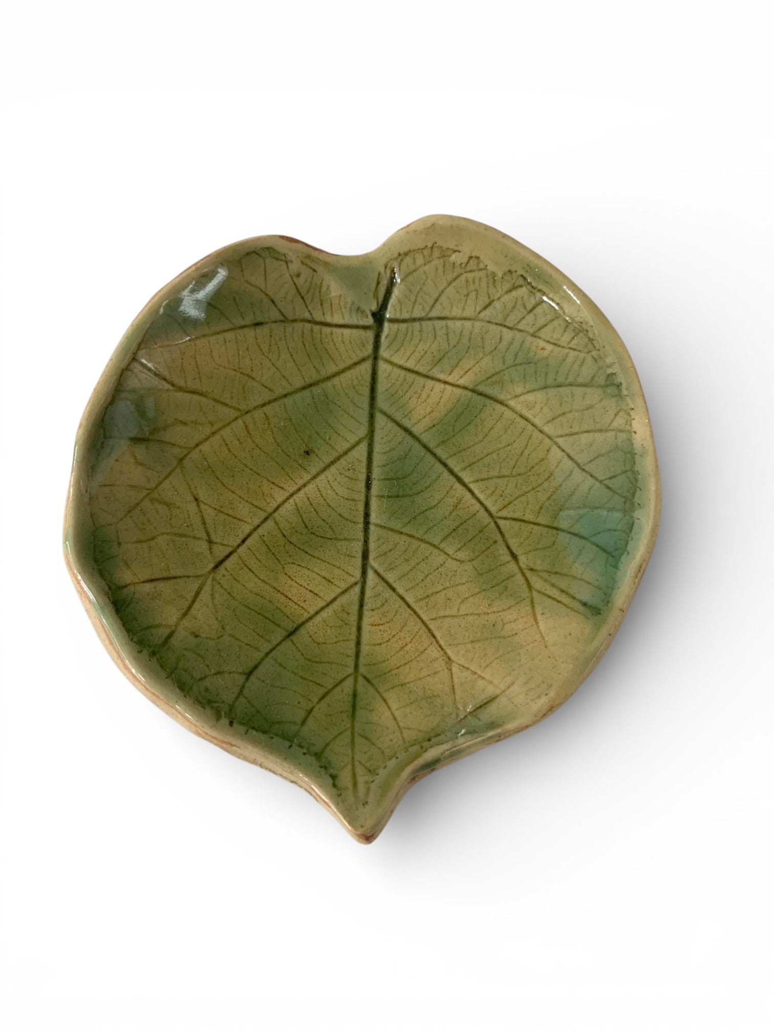 Hand-made ceramic plate with green enamel