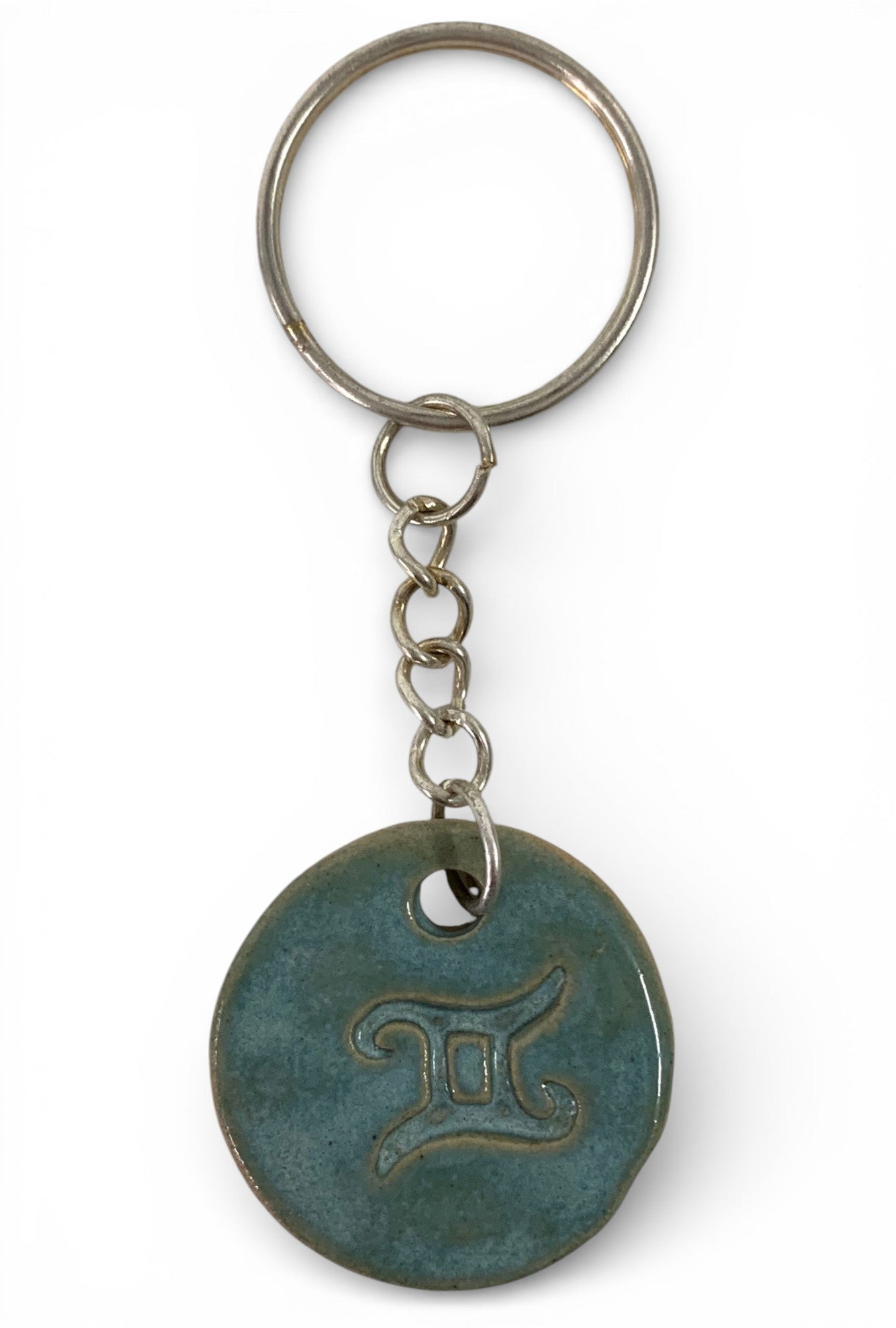 Hand-made ceramic key chain with terracotta enamel