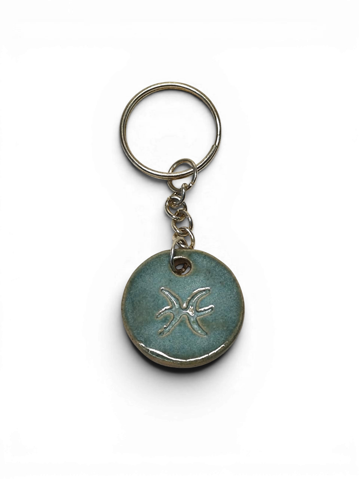 Hand-made ceramic key chain with terracotta enamel
