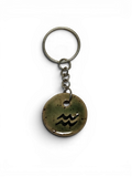 Hand-made ceramic key chain with enamel and sodiac symbols