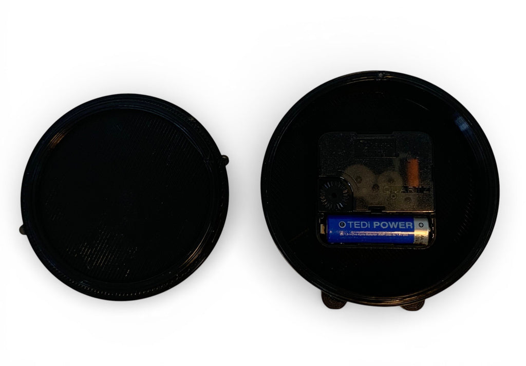Table clock with travelling design background.