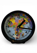 Table clock with travelling design background.
